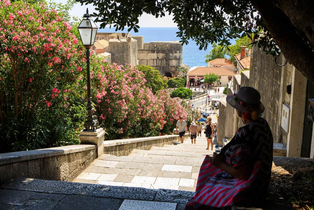 Dubrovnik, Croatia - People climb the stairs from Pile Gate, one of the main entrances to Dubrovnik`s Old town.