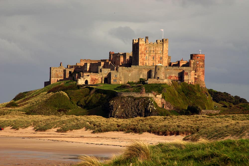 bamburgh castle from the north in evening light.