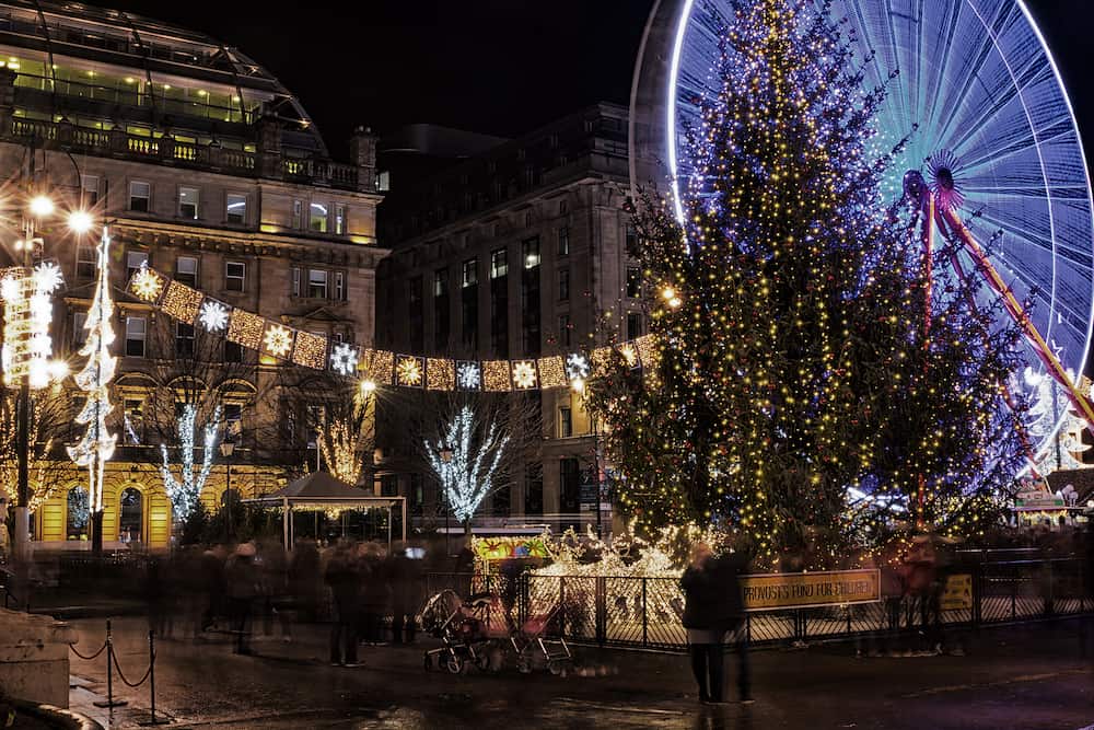 Glasgow Scotland UK: Christmas lights, Christmas tree and Christmas market in George Square at night. 