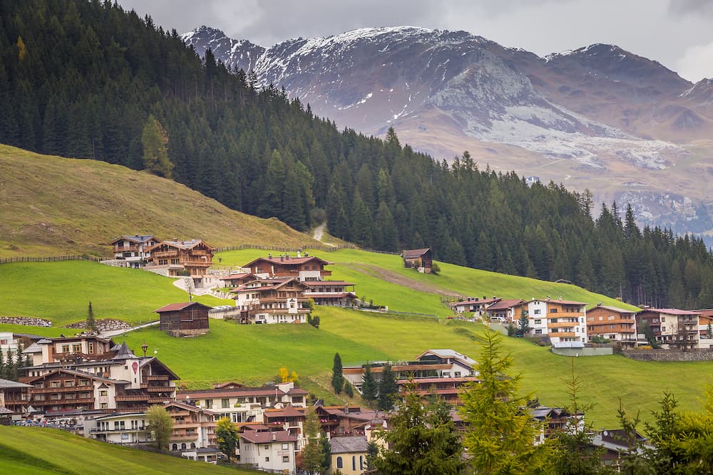 Tux village cityscape above Zillertal valley, Tyrol Snowcapped alps, Austria