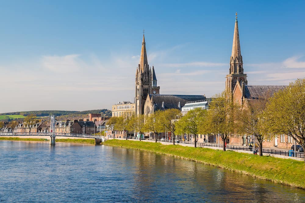 Inverness city with churches and bridge over Ness river in Scotland, United Kingdom of Great Britain and Northern Ireland