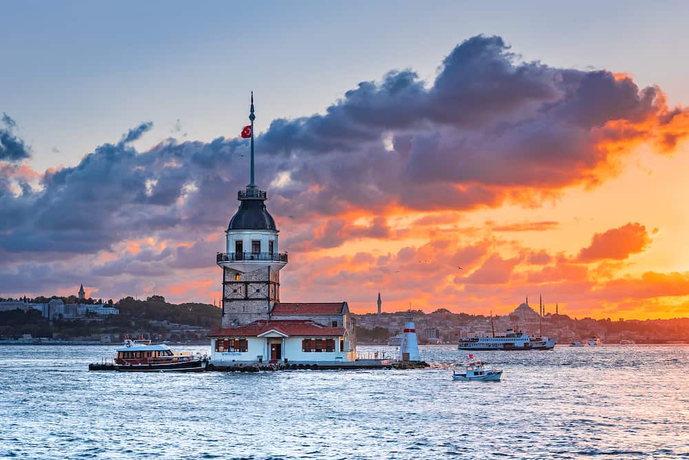 Istanbul, Turkey. Sunset over Bosphorus with famous Maiden's Tower (Kiz Kulesi) symbol of Istanbul, Turkey. Scenic travel background.