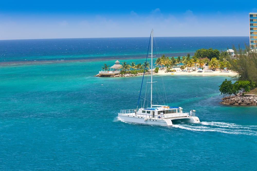 Large luxury catamaran sailing in the harbor of Ocho Rios Jamaica