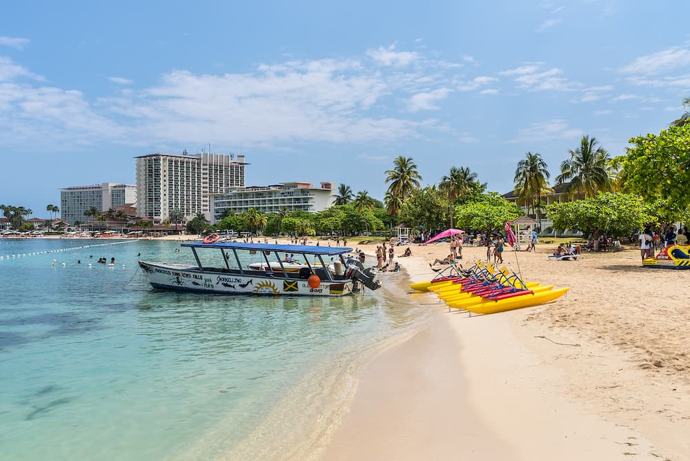 Ocho Rios, Jamaica - Motor boat and paddle boats (pedalos) on sandy Ocho Rios Bay Beach in Ocho Rios, Jamaica.
