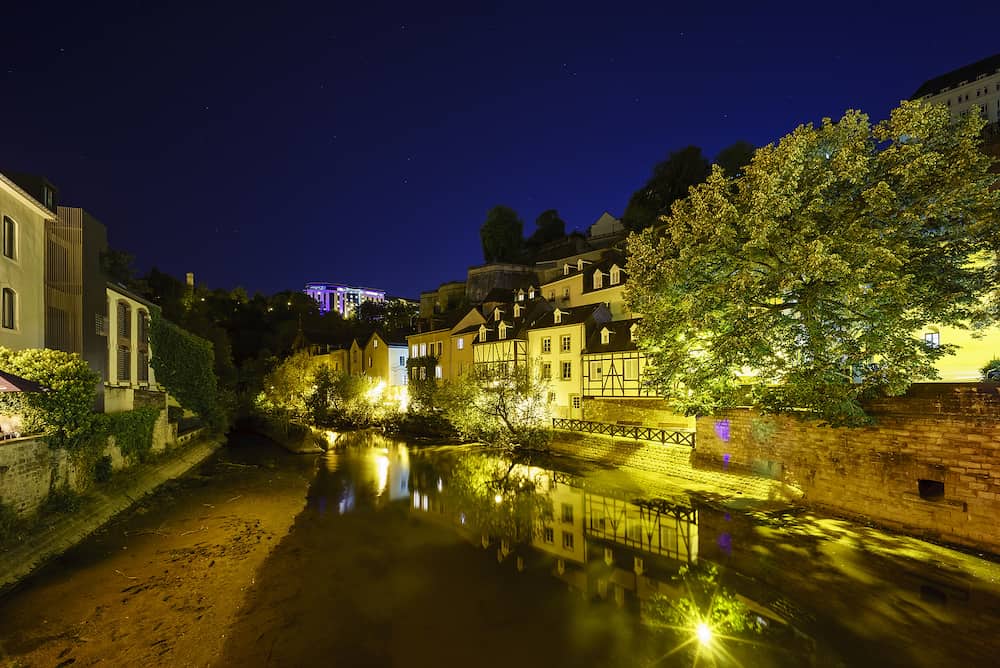 Beautiful Alzette river side scene on road Rue Munster of Luxembourg at night