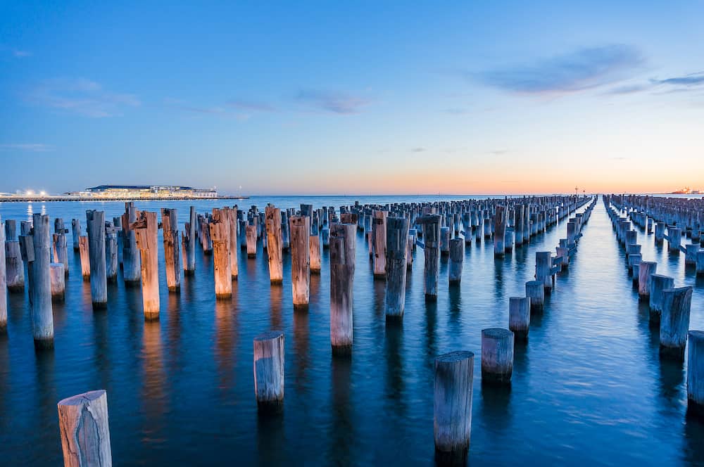 Old wooden pylons of historic Princes Pier in Port Melbourne at dusk. Australia. Long exposure landscape photo
