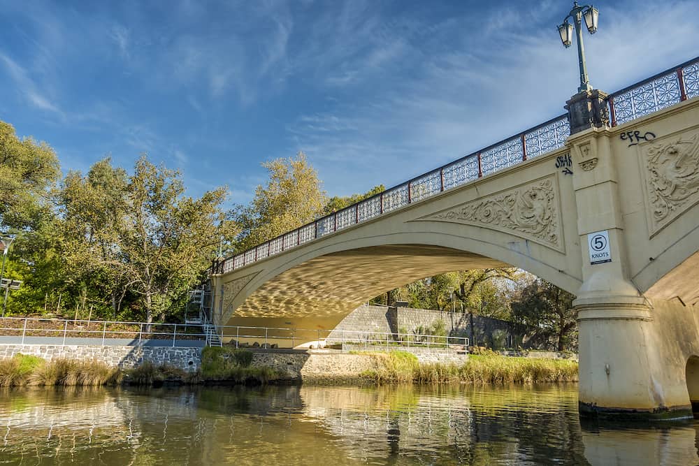 Melbourne, Australia - The ornate and iconic Morell Pedestrian Bridge as viewed from a tourist sightseeing boat cruising along the Yarra River.