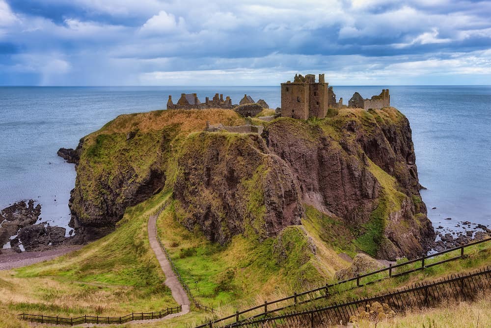 Dunnottar Castle ruins, Scotland - Dunnottar is a ruined medieval fortress located upon a rocky headland on the north-east coast of Scotland, about 3 kilometres (1.9 mi) south of Stonehaven
