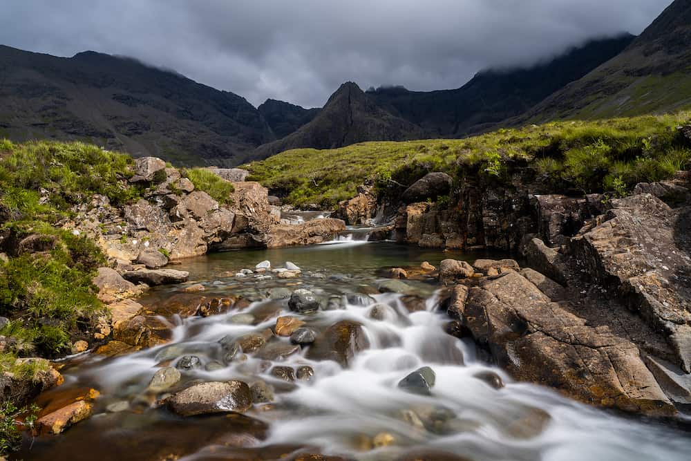 A view of the idyllic and picturesque cascades and pools at the Fairy Pools of the River Brittle on the Isle of Skye