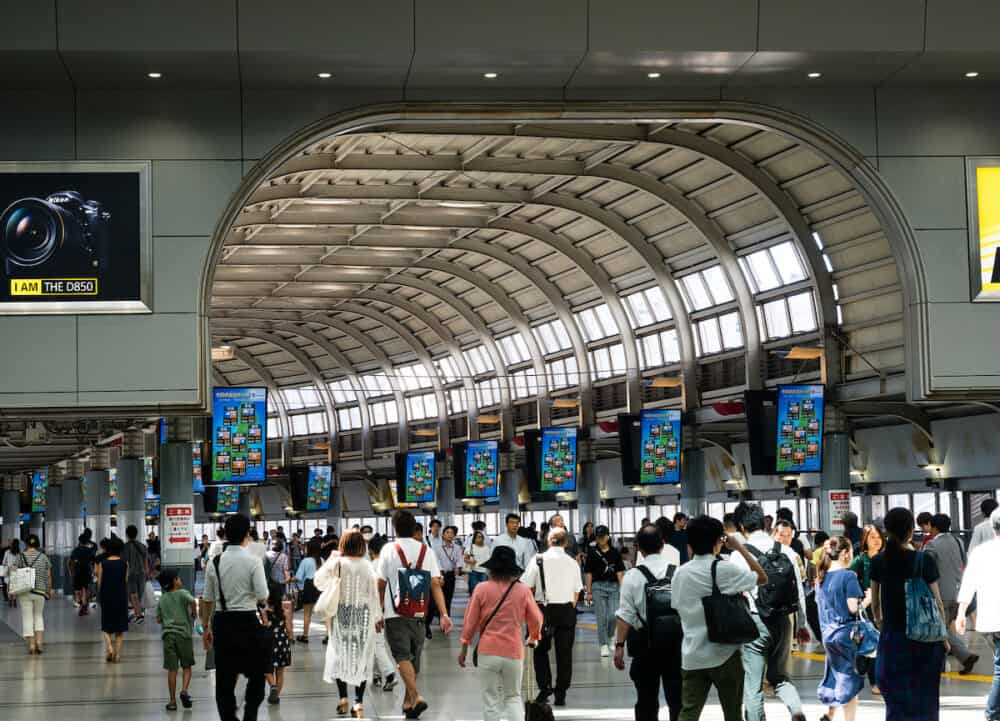 Tokyo, Japan - People walking inside the busy JR Shinagawa Station