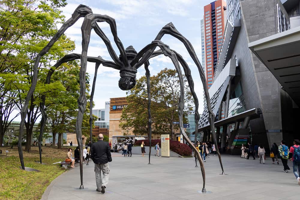 Tokyo, japn - Tourist walk around maman spider that located at mori art museum, roppongi hill, Tokyo, Japan