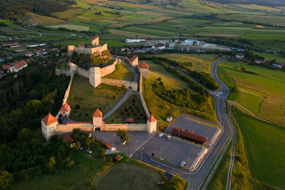 Fantastic travel place, gorgeous Rupea fortress, Transylvania, Romania - aerial view.