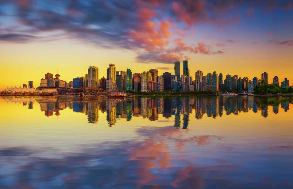 Sunset skyline of Vancouver downtown as seen from Stanley Park, British Columbia, Canada.