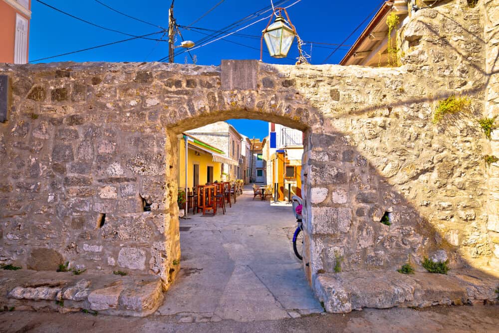 Ancient village of Sukosan near Zadar stone street and arch gate view Dalmatia region of Croatia