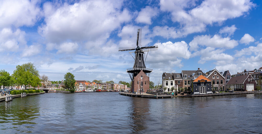 Haarlem, Netherlands - panorama view of the Dee Adrian Windmill and Binnen Spaarne River in Haarlem