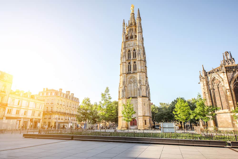 Morning view on the square with saint Pierre cathedral tower in Bordeaux city, France