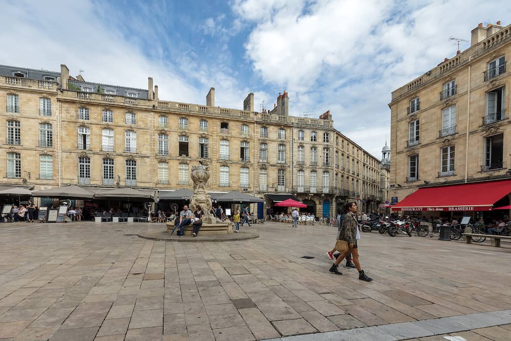 Bordeaux, France - Parliament Square or Place du Parlement . Historic square featuring an ornate fountain, cafes and restaurants in Bordeaux, France