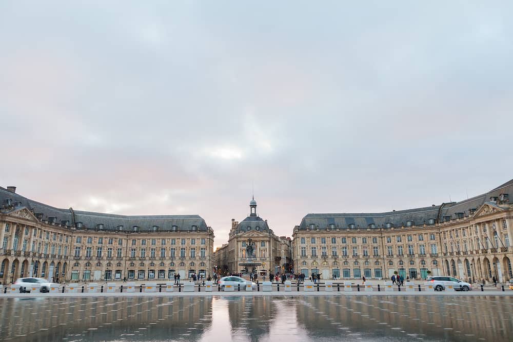 BORDEAUX, FRANCE - Water Mirror (Miroir d'Eau) fountain on place de la Bourse square. It is one of the symbols of Bordeaux, and the biggest reflecting pool in the World