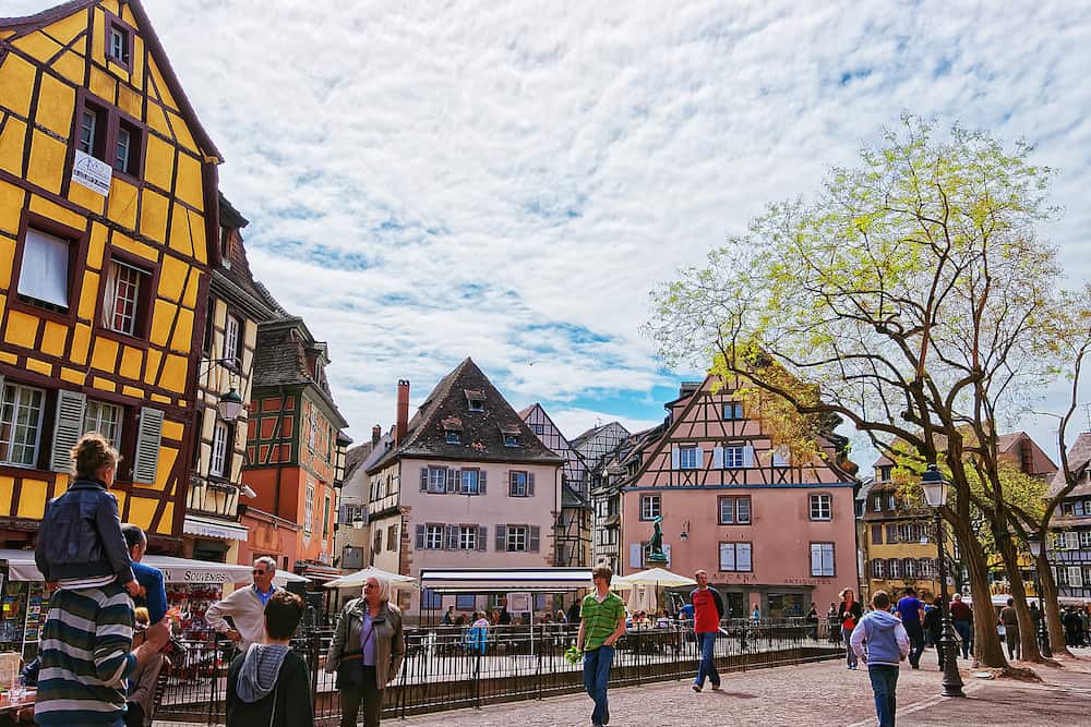 Colmar France - Old city center at Place de Ancienne Douane Square with Schwendi fountain in Colmar Haut Rhin in Alsace in France. People on the background