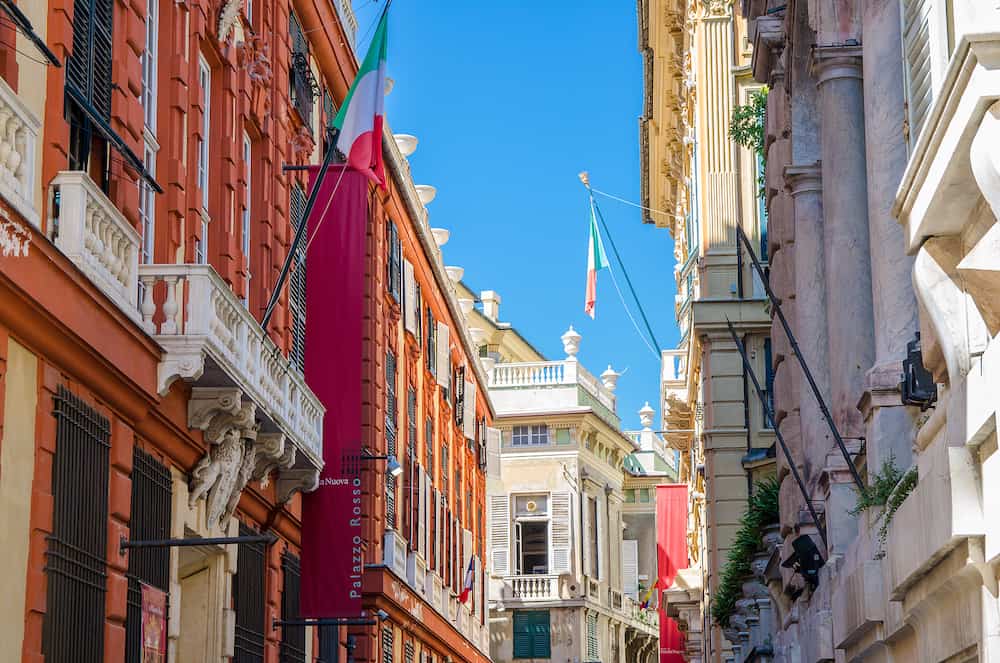 Genoa, Italy. Red palace Palazzo Rosso and White palace Palazzo Bianco colorful buildings on Via Garibaldi street in historical centre of old european city Genova, Liguria