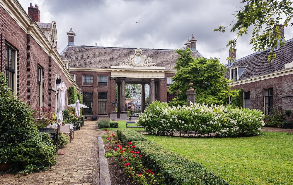The entrance of the almshouse the green garden in the old center of Haarlem in the Netherlands