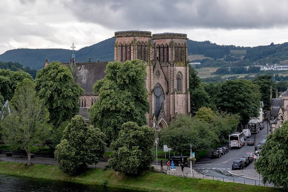 INVERNESS, SCOTLAND Inverness Cathedral, dedicated to St Andrew with Ness river in Scotland, United Kingdom