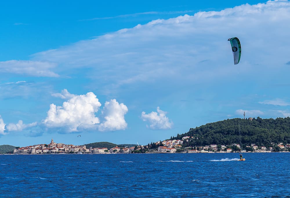 Unidentified windsurfer at Viganj beach with view at Korcula, Dalmatia, Croatia in Europe