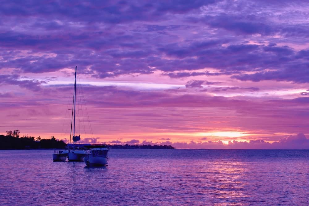 Yacht on the sea within a beautiful colorful sunset, Grand Baie, Mauritius