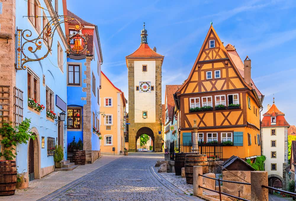 Rothenburg ob der Tauber, Bavaria, Germany. Medieval town of Rothenburg on a summer morning. Plonlein (Little Square) and the two towers of the old city wall.