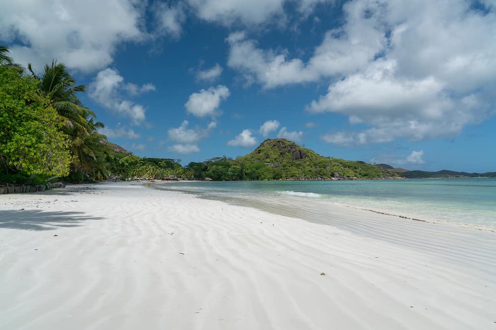 View along the long beach of Anse Volbert on the Seychelles.