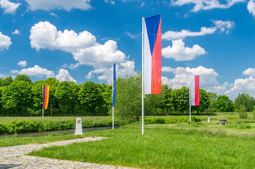 Flags of Czech Republic, Germany, Europe Union and Poland in Sudetes on border of three countries.