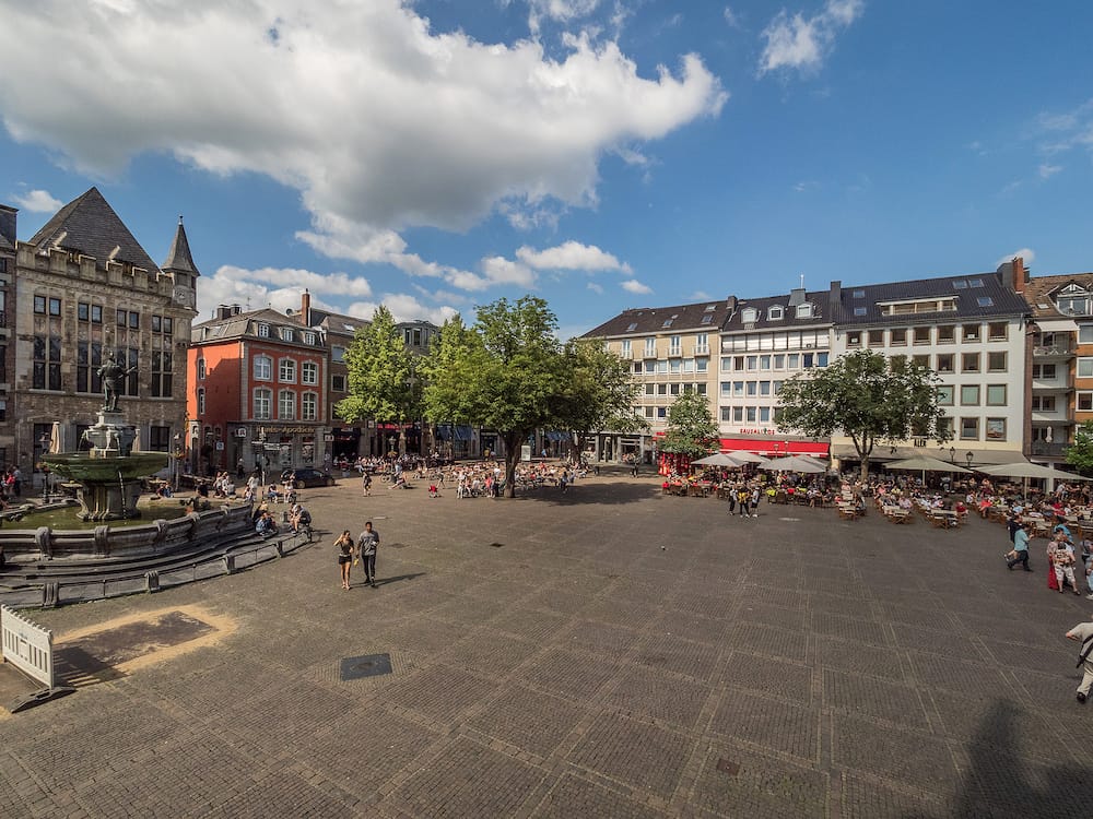 AACHEN, GERMANY - . Market Square (Marktplatz) with old fountain, medieval buildings and people in Aachen. Germany