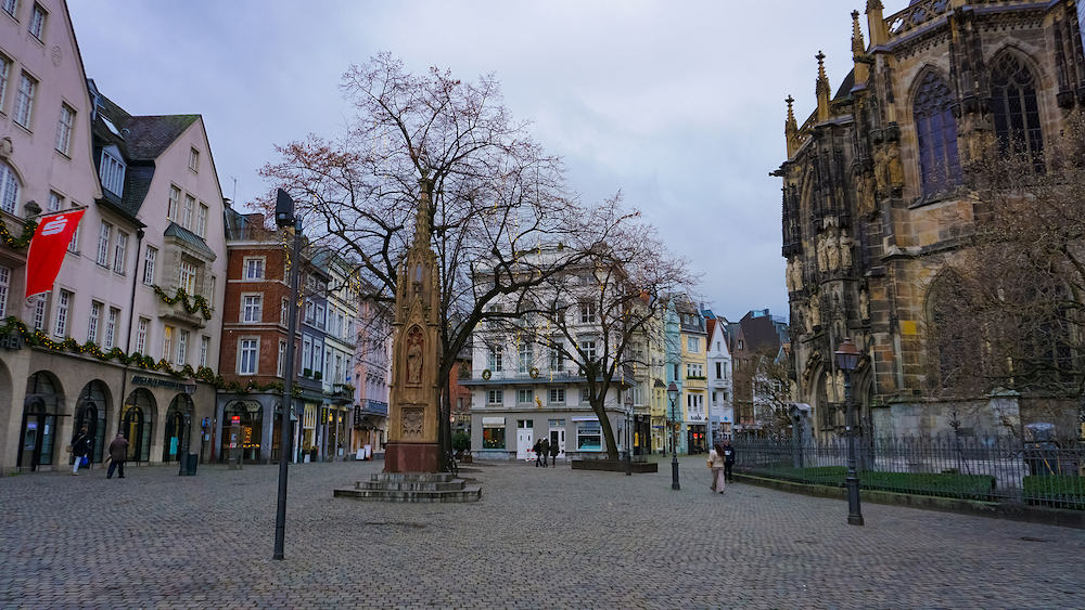 Aachen, Germany - People going at Rathausplatz in the old town at Aachen, Germany