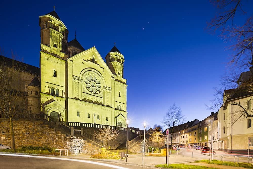 The catholic Herz-Jesu church in Aachen Burtscheid Germany with night blue sky.
