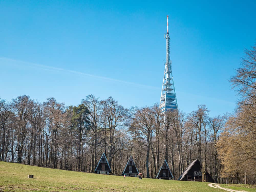 Kamzik TV transmission tower in Bratislava. Meadow and cottage house in the foreground