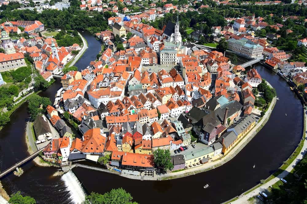 Panorama of Cesky Krumlov. A beautiful and colorful amazing historical Czech town. The city is UNESCO World Heritage Site on Vltava river. Aerial view from drone. Czech, Krumlov