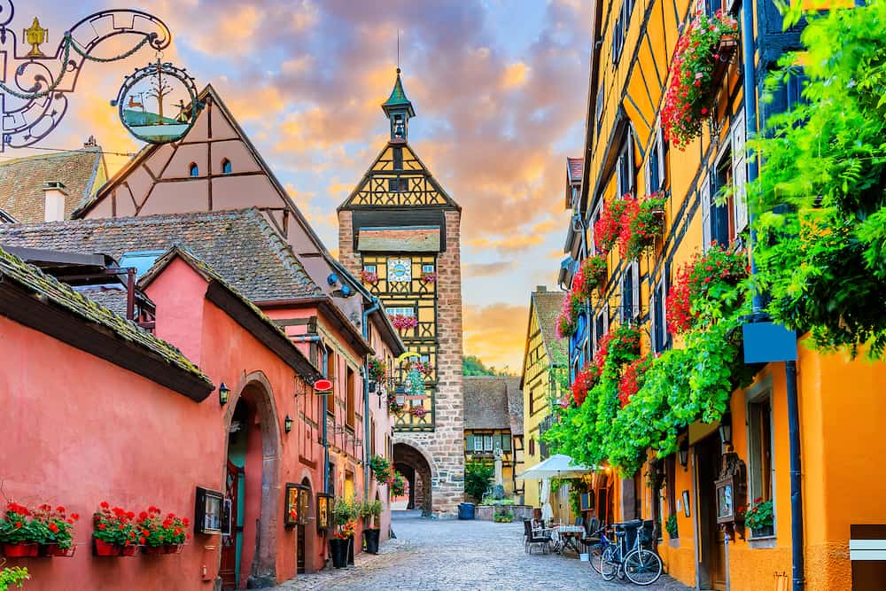 Riquewihr, France. Picturesque street with traditional half timbered houses on the Alsace Wine Route.