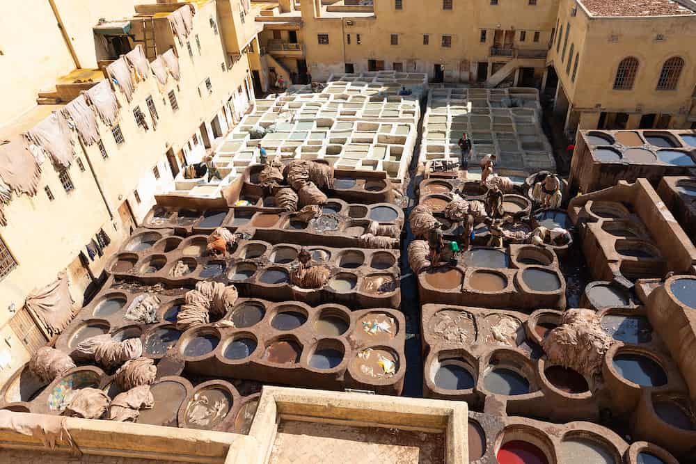 FEZ, MOROCCO - People dyeing leather in Chouara Tannery where one of the most popular place to visit in Fez City