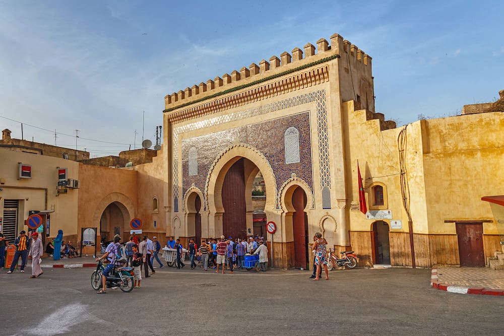 FEZ, MOROCCO - View of the famous historic Bab Bou Jeloud gate. Is an ornate city gate and the main western entrance to Fes el Bali, the old city of Fez.