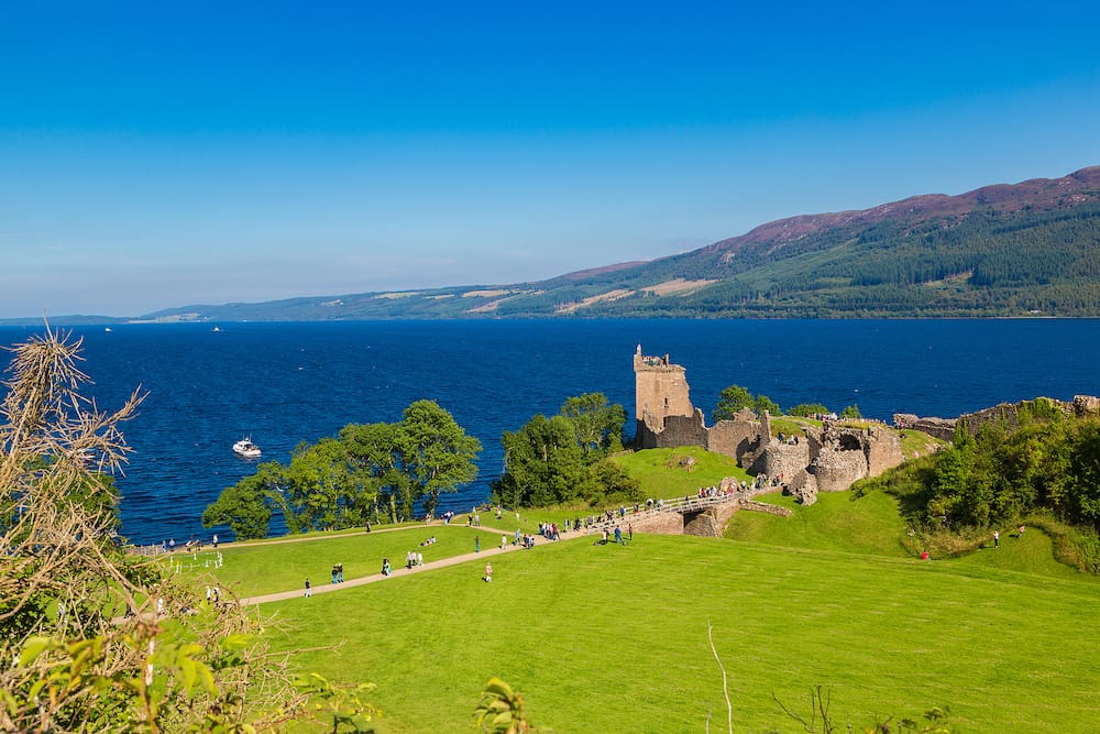 Urquhart Castle along Loch Ness lake in Scotland in a beautiful summer day, United Kingdom