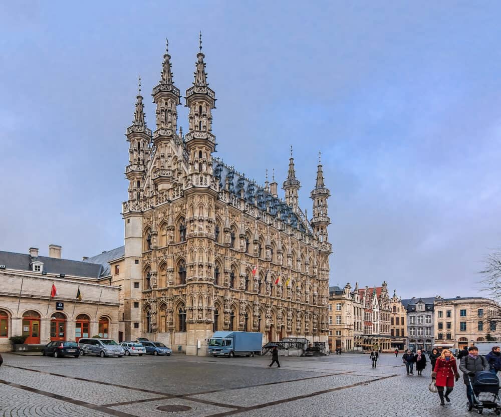 Leuven Belgium -  View on gothic town hall and people walking on Grote Markt square