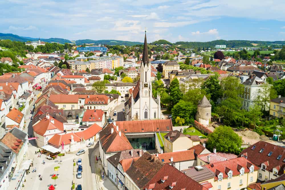 Stadtpfarrkirche or city parish church aerial panoramic view, Melk city centre. Melk is a city in the Wachau valley in Lower Austria.