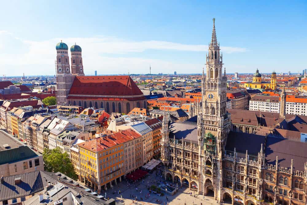 New Town Hall and Frauenkirche in Munich . Architecture of Marienplatz in Munich Bavaria Germany . Tourists visit Germany
