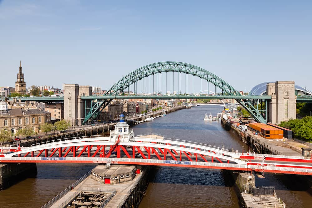 NEWCASTLE UPON TYNE, ENGLAND - The view from the High Level Bridge over the River Tyne to the Swing and Tyne Bridges on May 21, 2018. The bridges connect Newcastle upon Tyne and Gateshead.