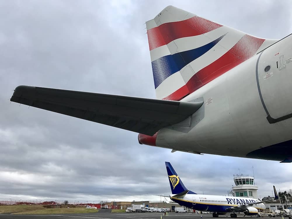 NEWCASTLE UPON TYNE - Competitors British Airways and Ryanair commercial jet aircraft parked on stands at Newcastle International Airport in Newcastle upon Tyne, Tyne and Wear, UK.
