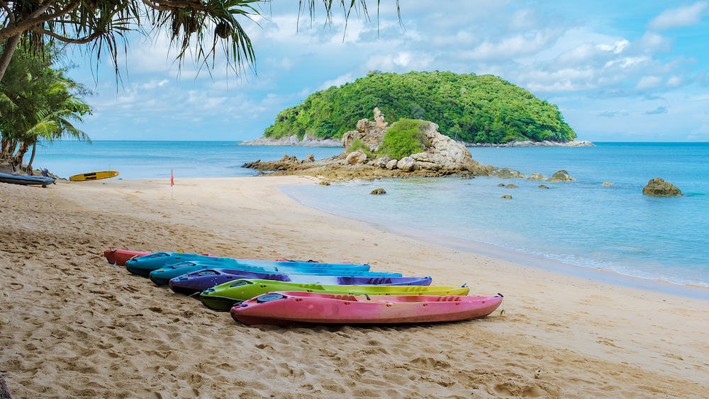 Yanui beach Phuket Thailand with kayaks on the beach, tropical beach with the blue ocean