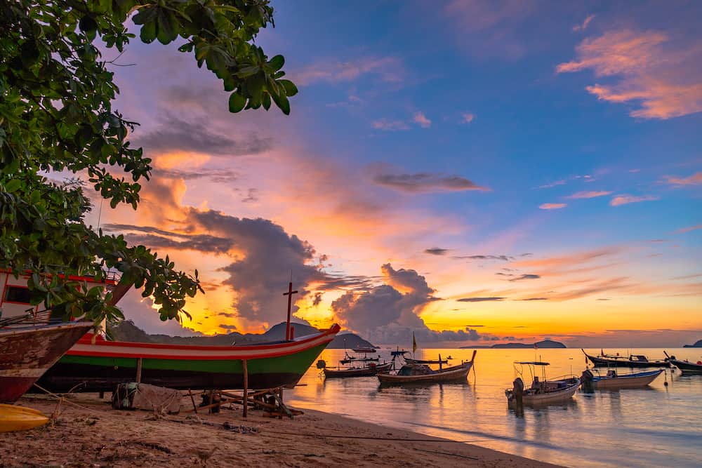 beautiful sunrise above fishing boats on Rawai beach, Phuket,Thailand.