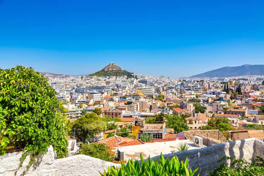 Old city Plaka Athens view with mount Lycabettus during summer sunny day