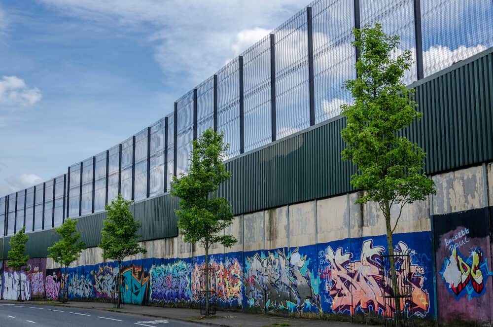 BELFAST, COUNTRY ANTRIM, NORTHERN IRELAND - This peace wall in Belfast, dividing the Falls and Shankill Roads, is one of a series of barriers that have been built in urban interface areas to separate catholic and protestant communities.