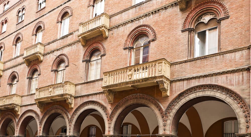 Arcade windows and balconies on an elegant building in Bologna Italy